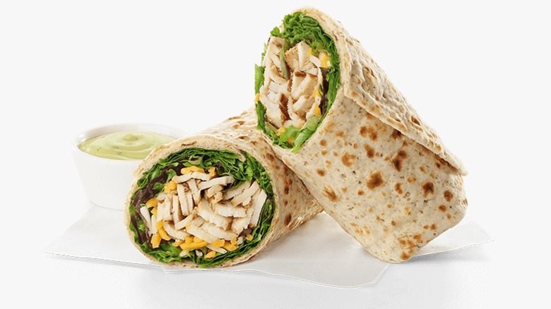 A Chick-fil-A Grilled Chicken Cool Wrap on a napkin on a white background