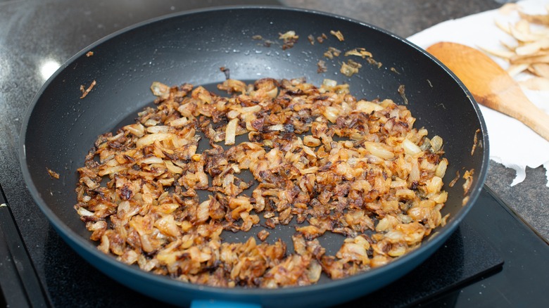 Browned diced onions in pan