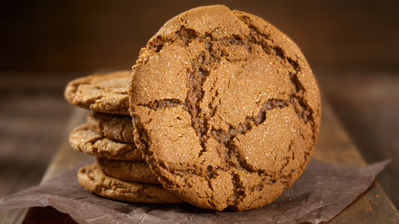 Gingersnap cookies on brown board