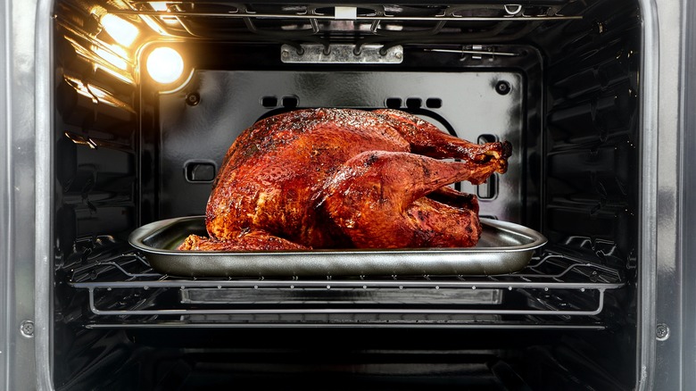 Full Thanksgiving turkey in oven