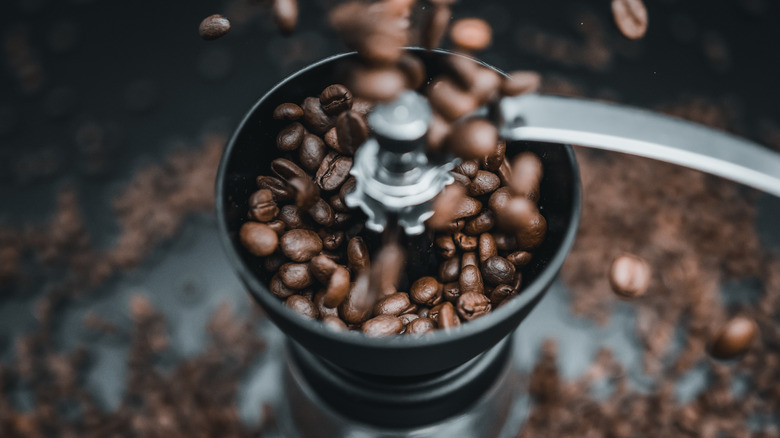Coffee beans in a coffee grinder