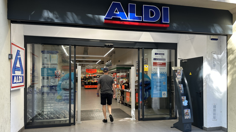 Person walking through entrance of an Aldi