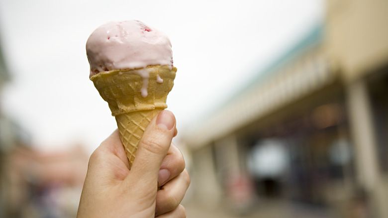 hand holding an ice cream cone