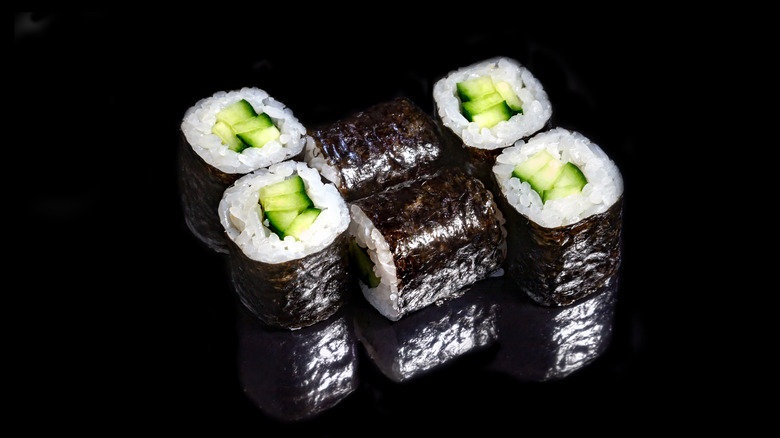 Kappa maki rolls on black background