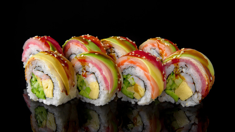 Rainbow rolls on black background