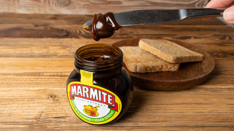 Marmite spread taken out from the jar