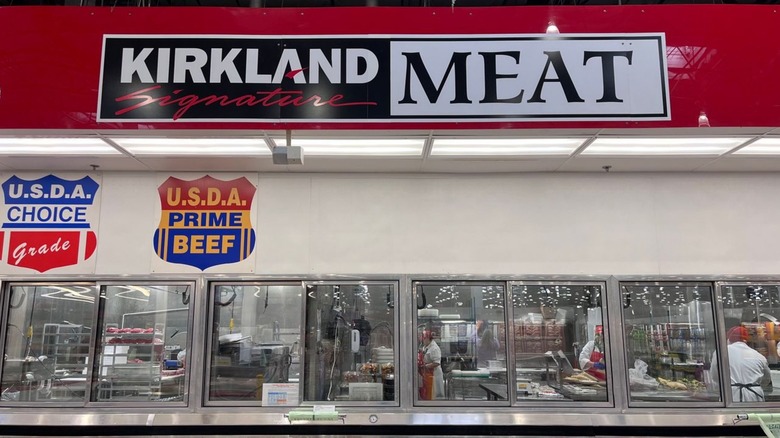Sign at a Costco meat department that says "Kirkland Signature Meat"