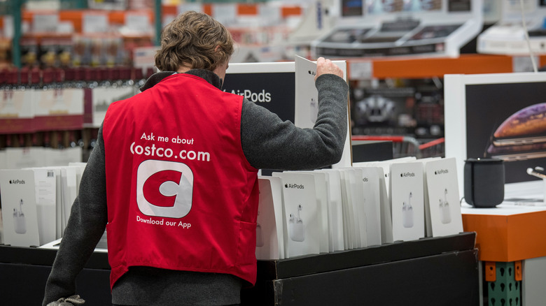 Costco employee looking through AirPods
