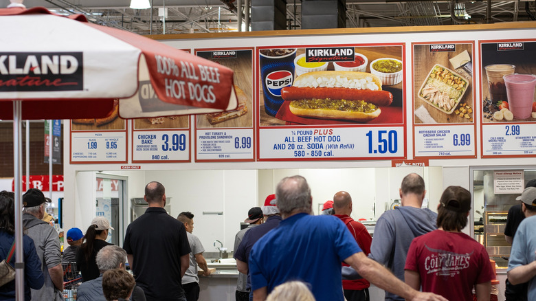 Customers waiting to pick up their orders at a Costco food court.