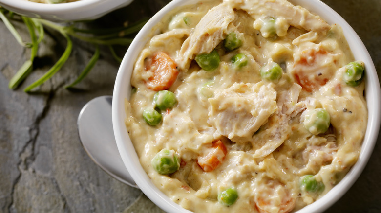 A creamy chicken dinner in a bowl, ready to eat