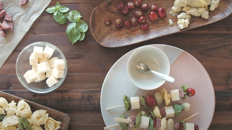 Preparing tortellini skewers 