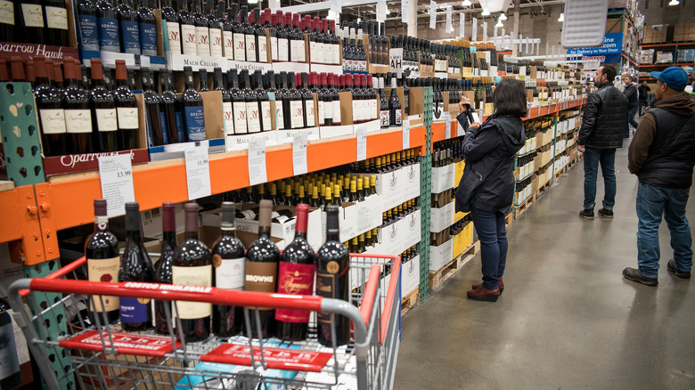shoppers browing Costco wine aisle