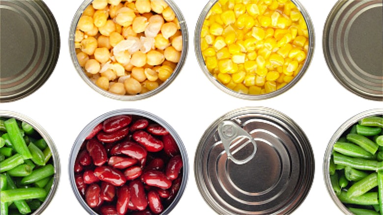 Open cans of beans and corn