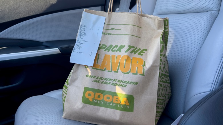 Take out Qdoba bag