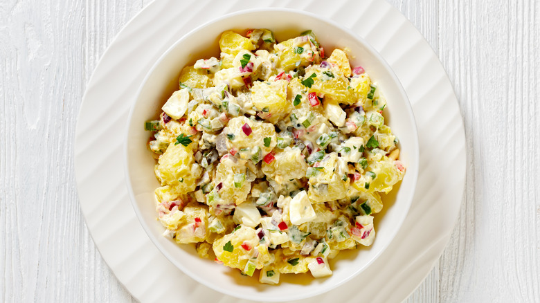Potato salad in a white bowl
