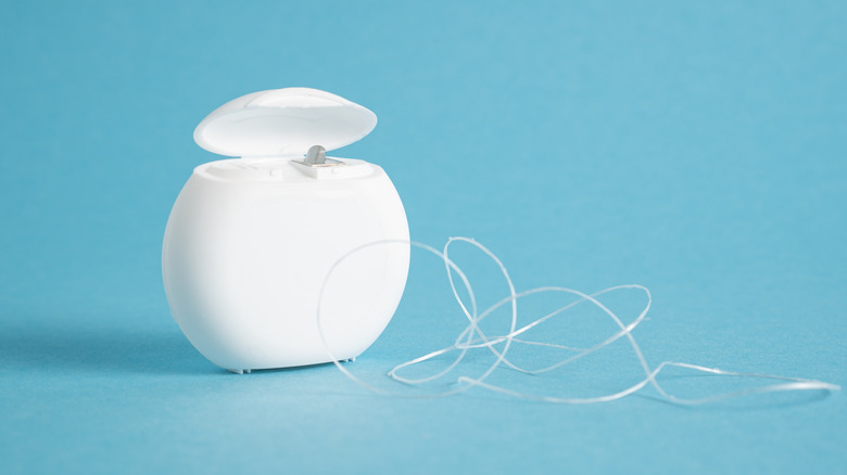 dental floss sitting beside container
