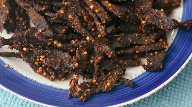 Spicy beef jerky on plate