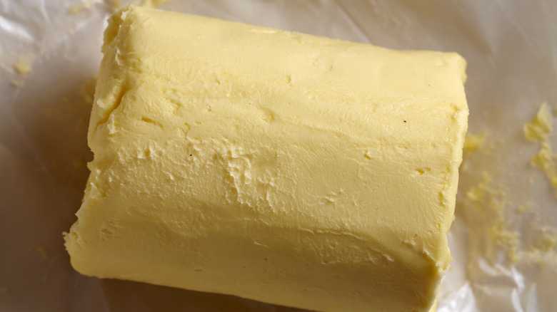 A roll of Amish butter on parchment paper