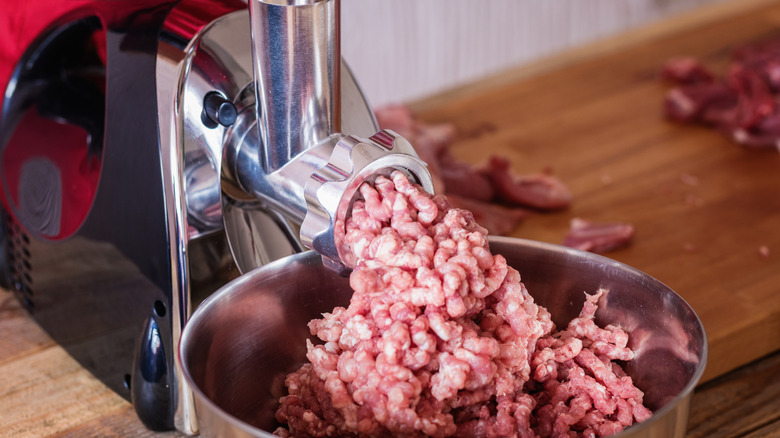 Ground beef in a meat grinder