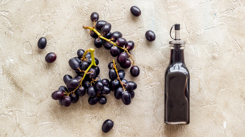 Vinegar bottle with grapes