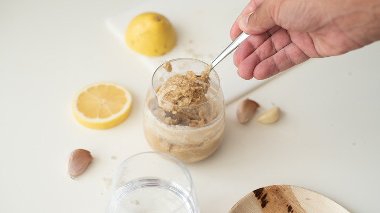 Man making tahini at home