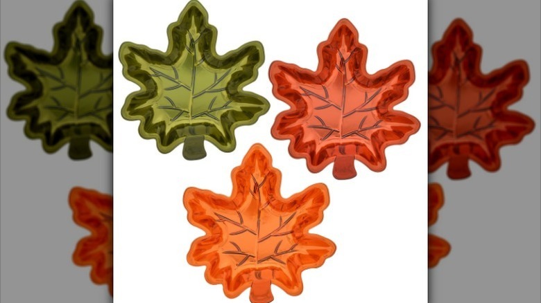 Three color options of maple leaf dinner plates on white background