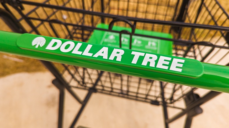 Push handle of a Dollar Tree shopping cart showing the logo