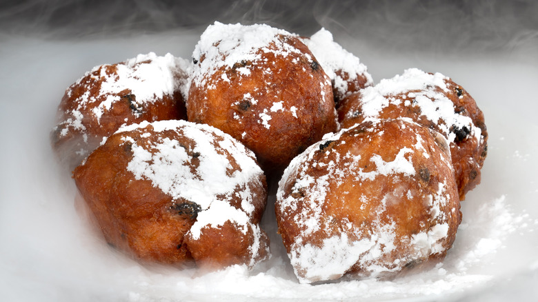 oliebollen coated in powdered sugar