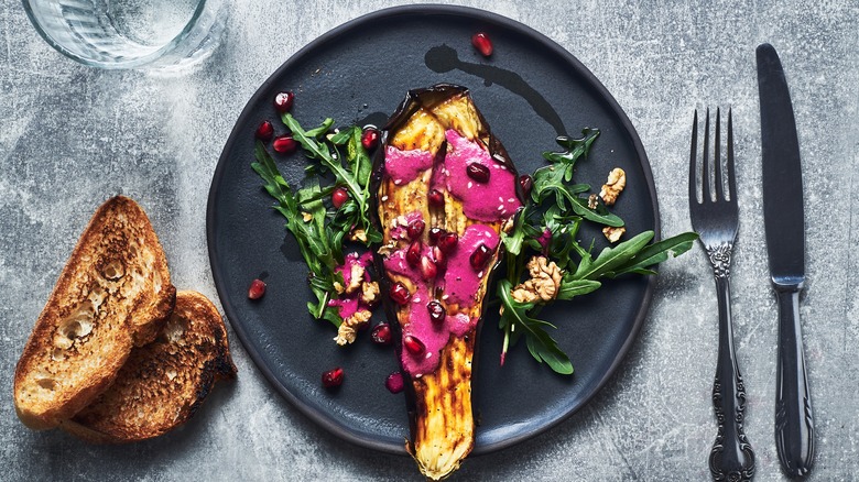 grilled eggplant with sauce on plate