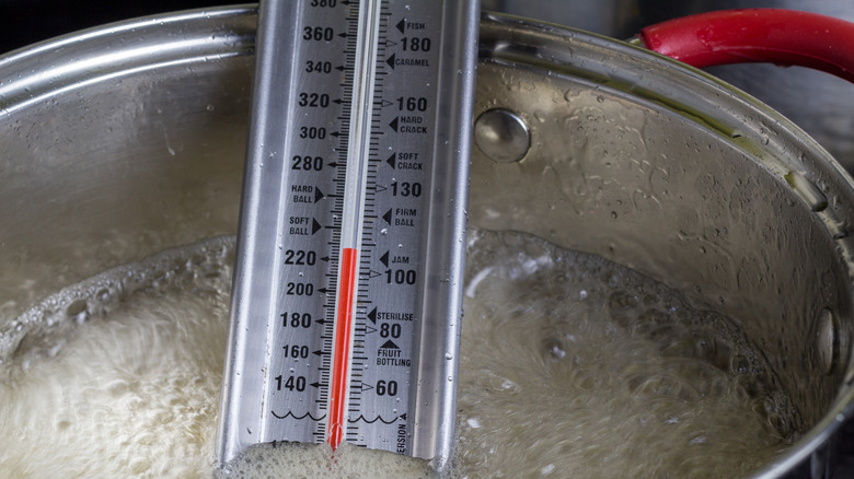 Candy thermometer in boiling sugar