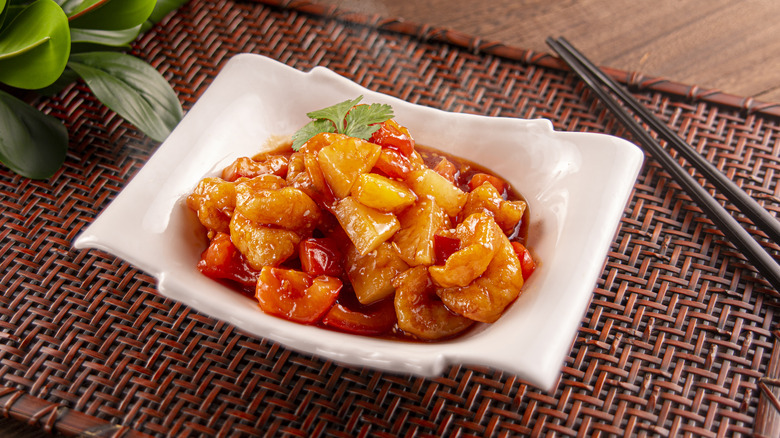 A bowl of sweet and sour chicken