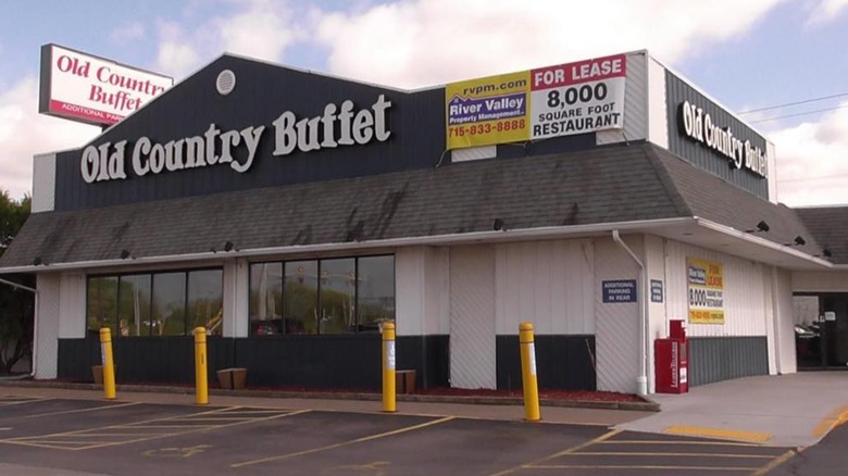 An empty Old Country Buffet with a "For Lease" sign on it