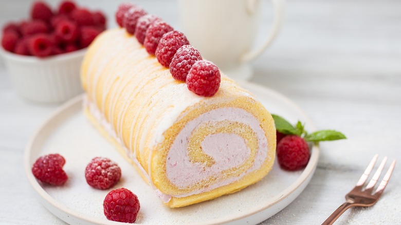 Roll cake with raspberries on top
