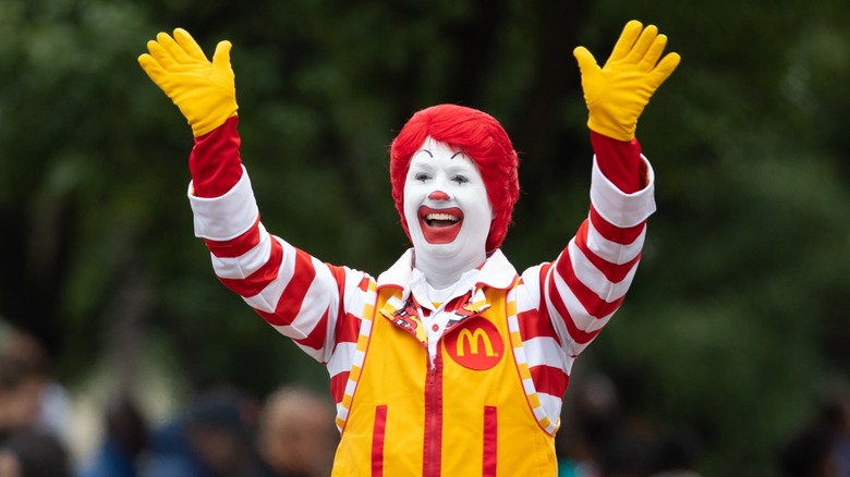 Ronald McDonald smiling and waving