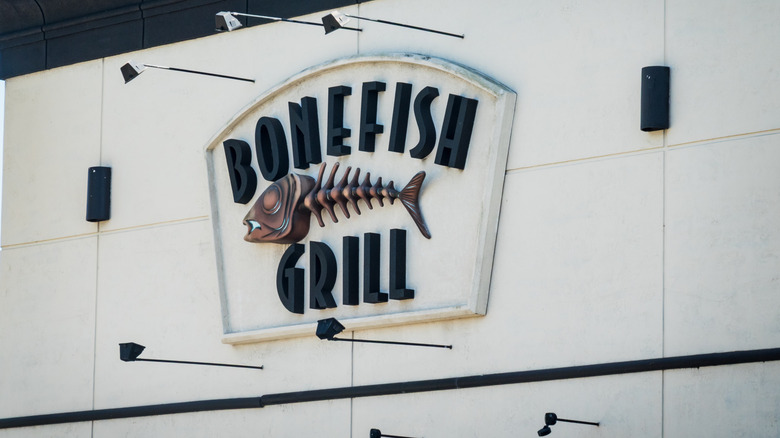A large sign of the Bonefish Grill logo on the exterior of a restaurant location
