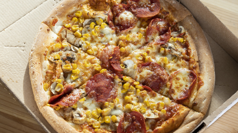 pizza topped with corn