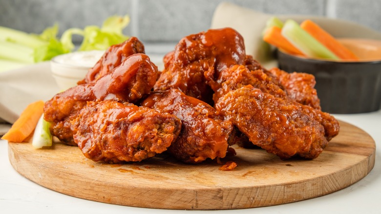 Buffalo wings on wooden dish