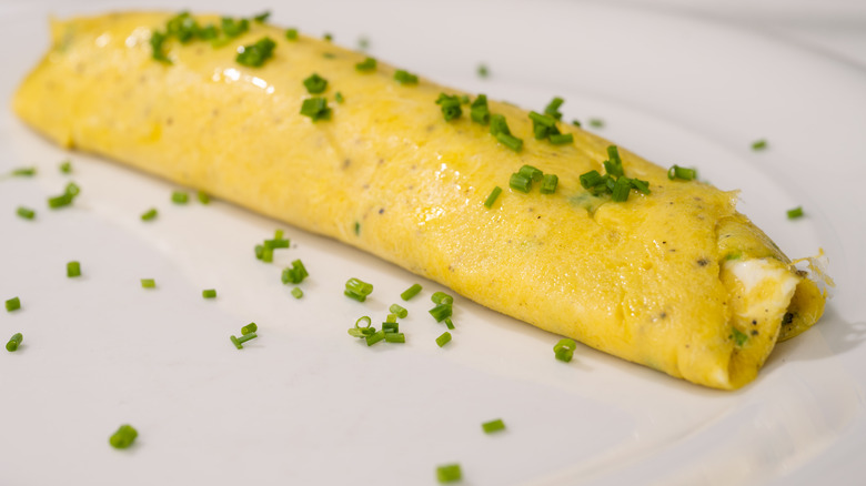 A French omelet garnished with herbs