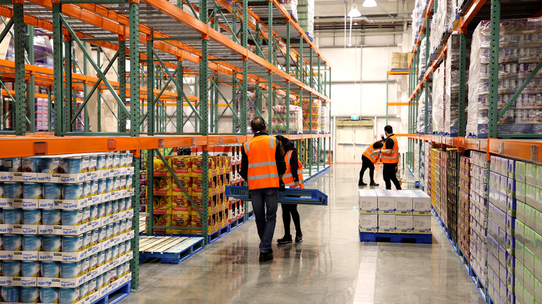 Costco employees set up the store