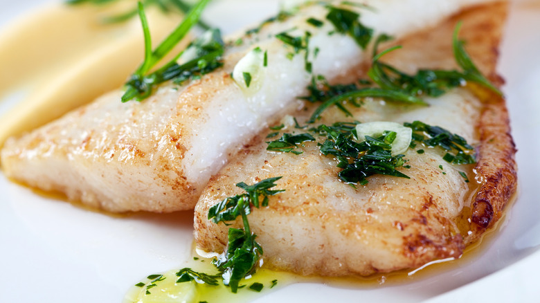 Skinless white fish filets with herbed butter