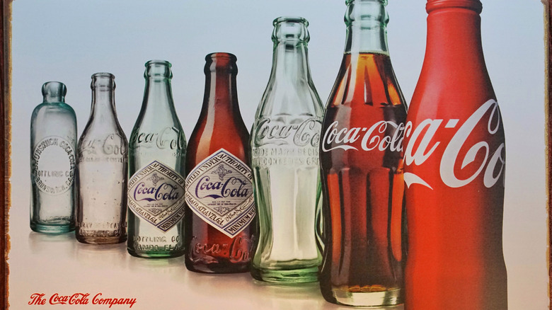 row of vintage glass coca cola bottles