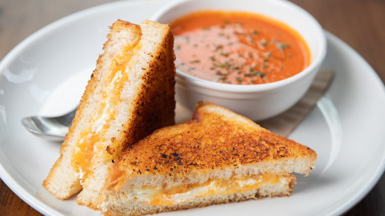 Classic grilled cheese with a bowl of tomato soup