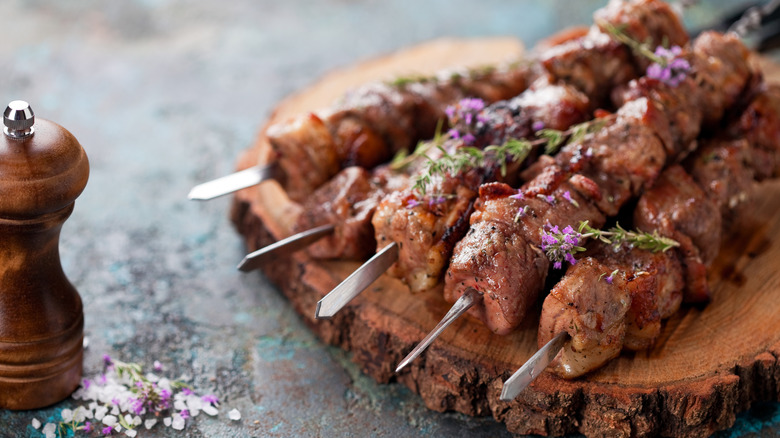 meat cooked on metal skewers