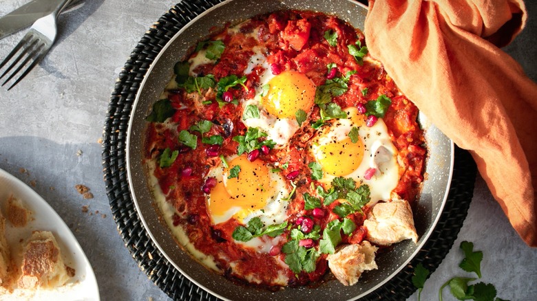 shashaka in a pan with tomatoes and eggs