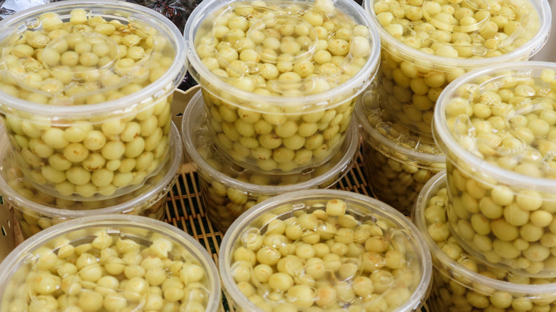 Pickled grapes in plastic containers