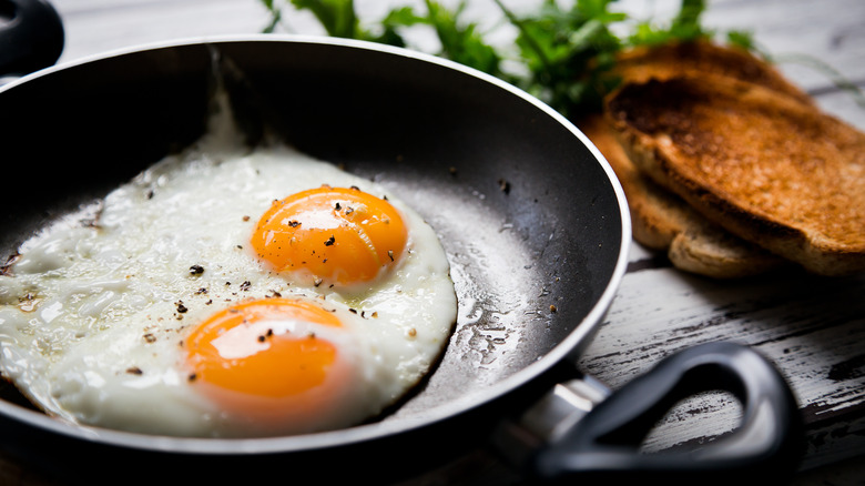 fried eggs in a saucepan 