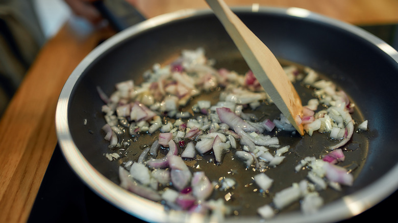 Garlic and onion simmering in pan