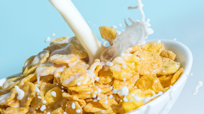 Milk splashes into cereal