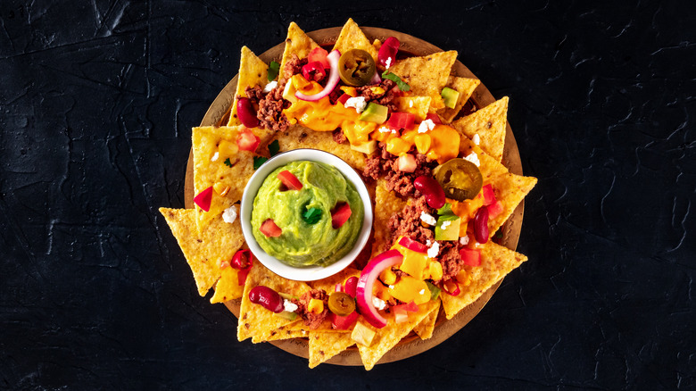 Pan of nachos with toppings