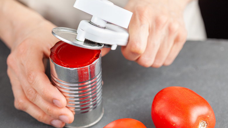 Opening a can of tomato paste 